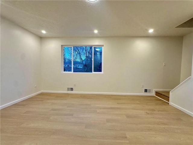 unfurnished room featuring light wood-type flooring