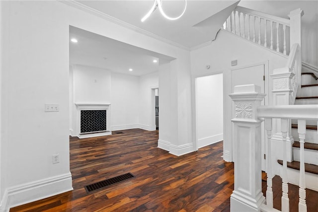 living room featuring dark hardwood / wood-style flooring and ornamental molding