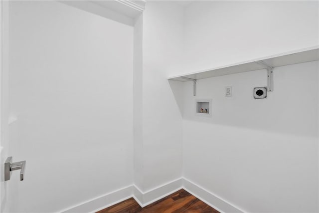 clothes washing area with washer hookup, dark wood-type flooring, hookup for an electric dryer, laundry area, and baseboards