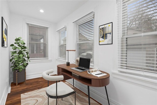 office space with dark hardwood / wood-style flooring