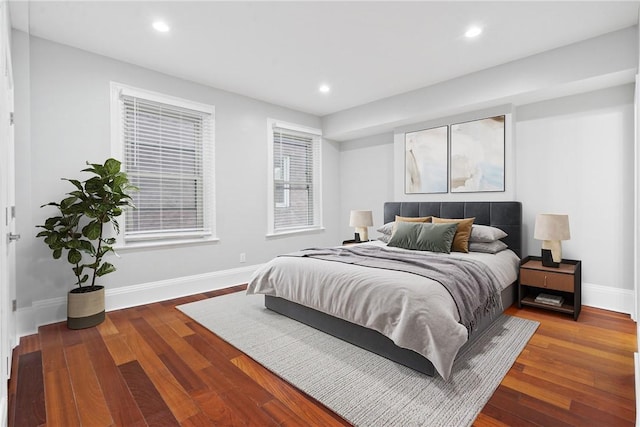 bedroom featuring dark wood-style floors, baseboards, and recessed lighting