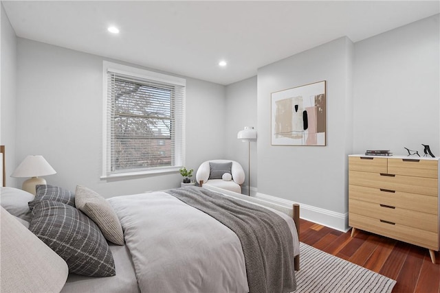 bedroom featuring recessed lighting, dark wood-style flooring, and baseboards