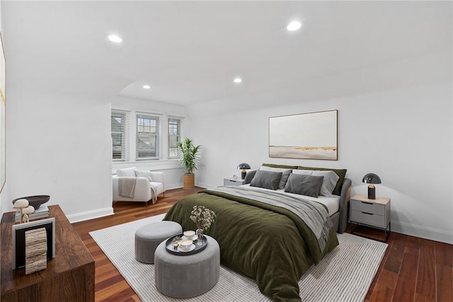 bedroom featuring recessed lighting, dark wood-style flooring, and baseboards