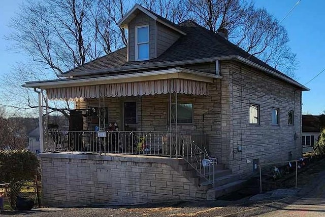 view of home's exterior featuring covered porch