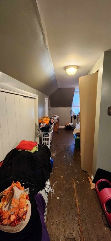 bonus room featuring lofted ceiling and dark wood-type flooring