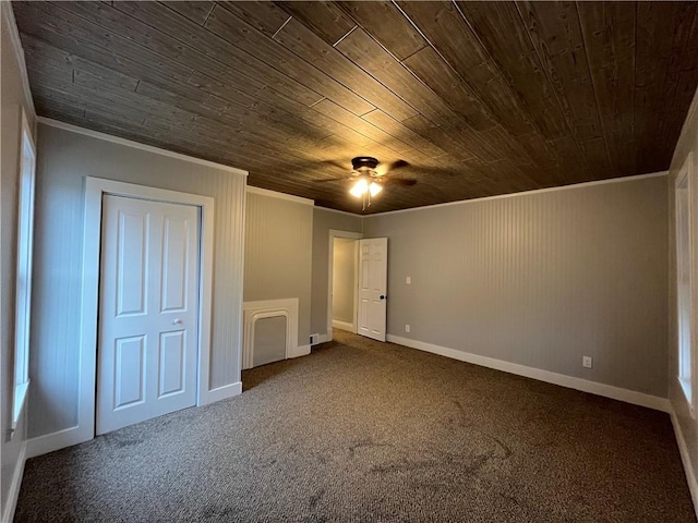 unfurnished bedroom featuring crown molding, ceiling fan, carpet, and wooden ceiling