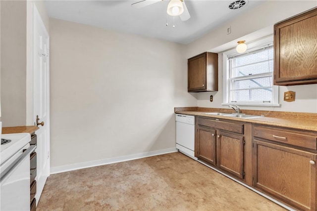 kitchen with ceiling fan, sink, and white appliances