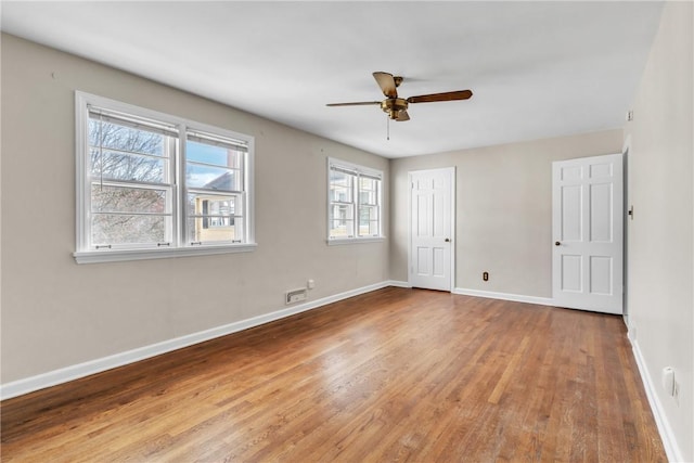 unfurnished room featuring ceiling fan and light wood-type flooring