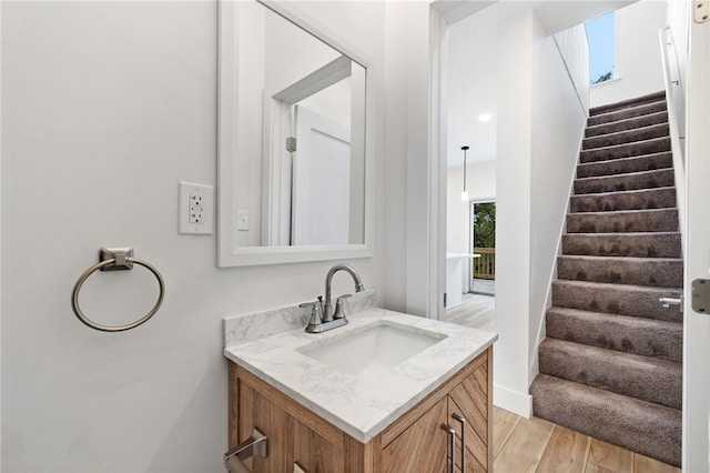 bathroom with vanity and hardwood / wood-style floors