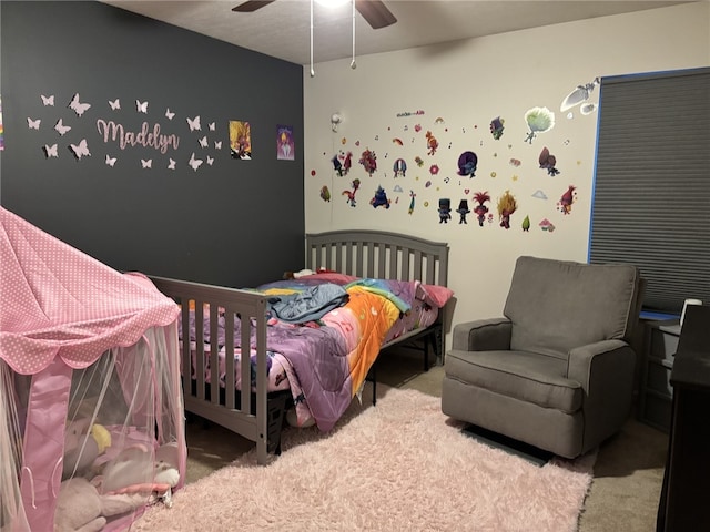 bedroom featuring ceiling fan and carpet floors