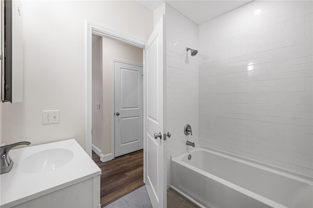 438 N Fairmount St Unit 1, Garfield, PA 15206 - bathroom with hardwood / wood-style flooring, tiled shower / bath, and vanity