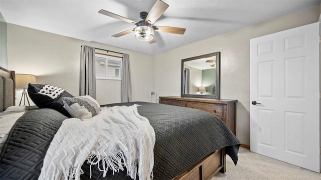 bedroom featuring ceiling fan and light colored carpet