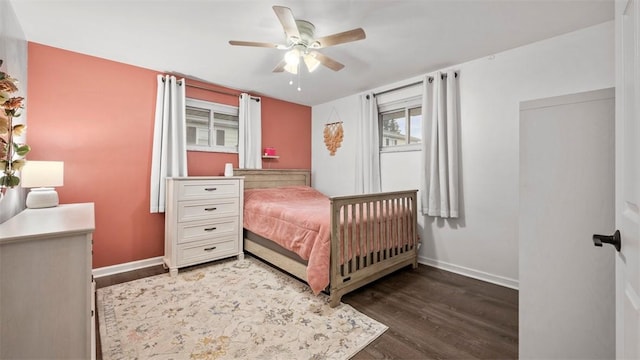 bedroom featuring dark hardwood / wood-style floors and ceiling fan