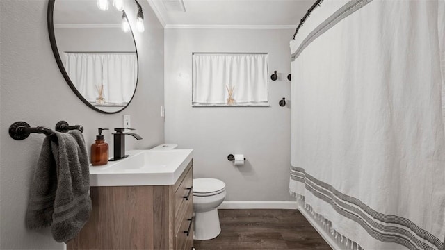 bathroom with ornamental molding, toilet, wood-type flooring, and vanity