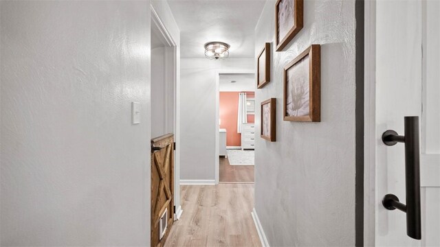 corridor featuring light hardwood / wood-style flooring