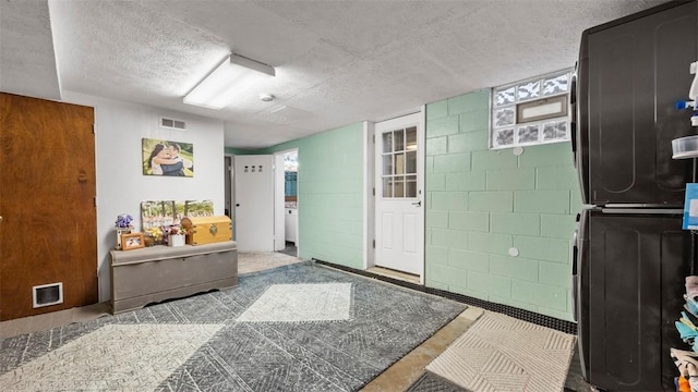 entrance foyer featuring a textured ceiling