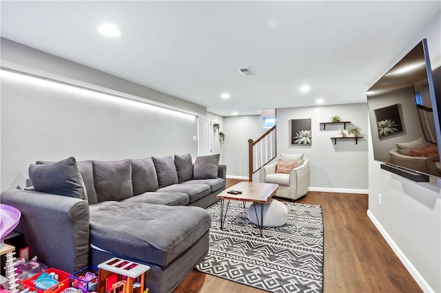 living room with dark hardwood / wood-style floors