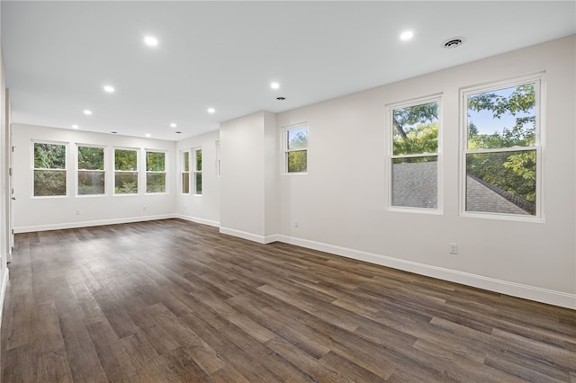 unfurnished room with dark hardwood / wood-style floors