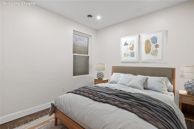 bedroom with hardwood / wood-style flooring