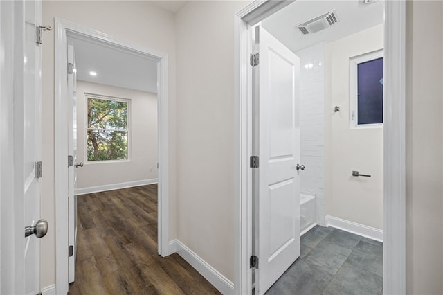 hall with dark hardwood / wood-style floors