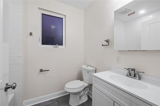 bathroom with vanity and toilet