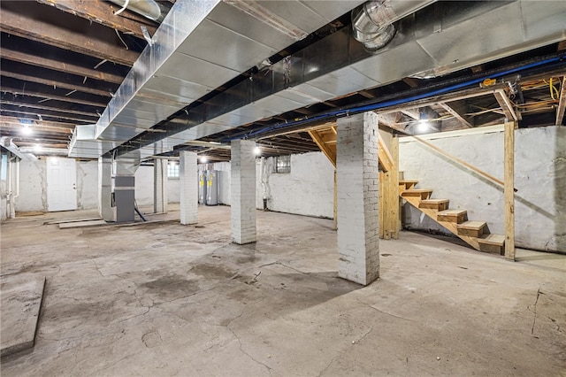 basement with heating unit and electric water heater