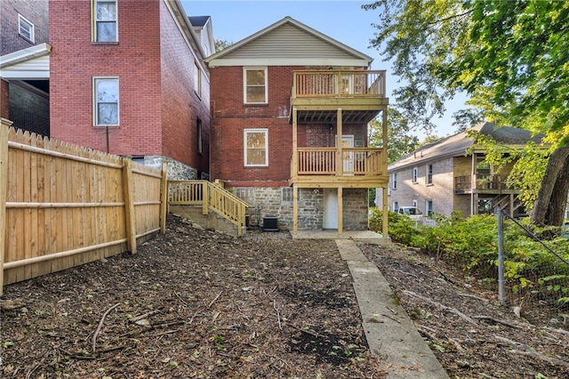 rear view of house with a balcony