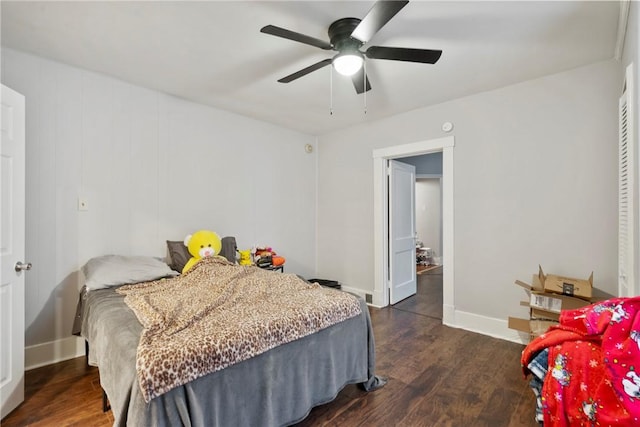 bedroom featuring ceiling fan and dark hardwood / wood-style floors