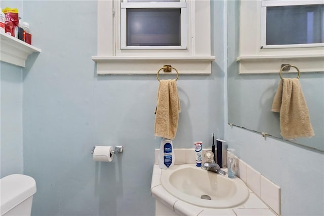 bathroom featuring toilet and sink