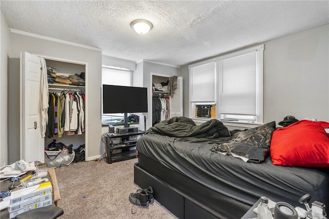 bedroom featuring crown molding, carpet floors, a textured ceiling, and cooling unit