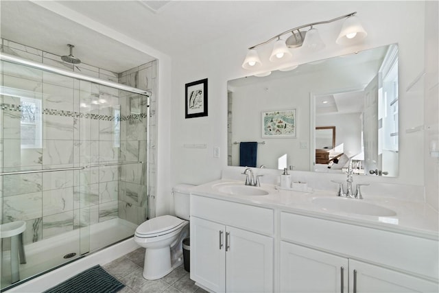 bathroom featuring vanity, tile patterned flooring, a shower with door, and toilet