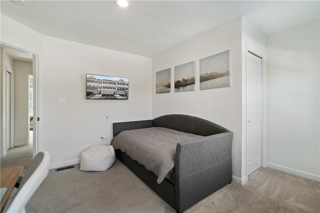 living area featuring light colored carpet