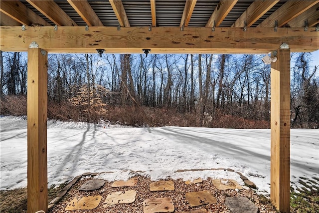 view of yard layered in snow