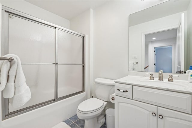 full bathroom with vanity, tile patterned flooring, toilet, and combined bath / shower with glass door