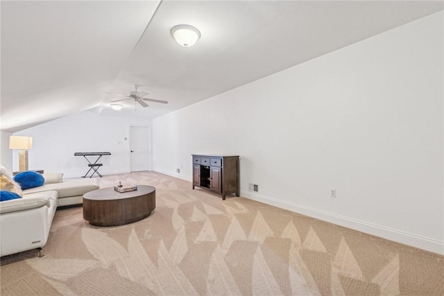 carpeted living room with vaulted ceiling and ceiling fan