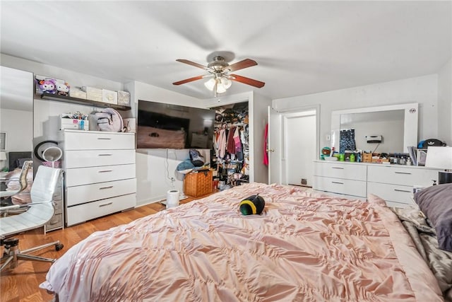 bedroom featuring ceiling fan and light hardwood / wood-style flooring