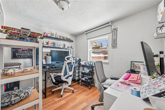 office featuring hardwood / wood-style flooring and a textured ceiling