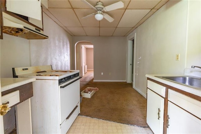 kitchen featuring a paneled ceiling, white cabinetry, sink, ceiling fan, and white gas stove