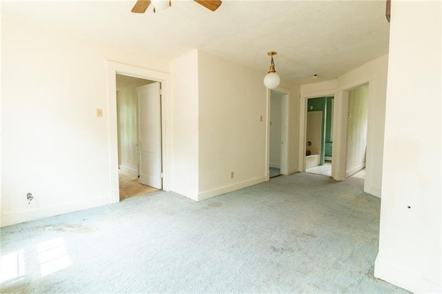 empty room with light carpet and ceiling fan