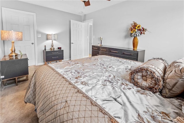 bedroom featuring ceiling fan and carpet