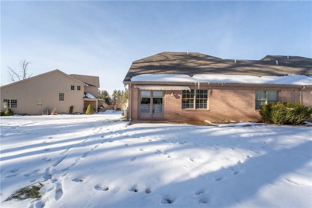 view of snow covered house