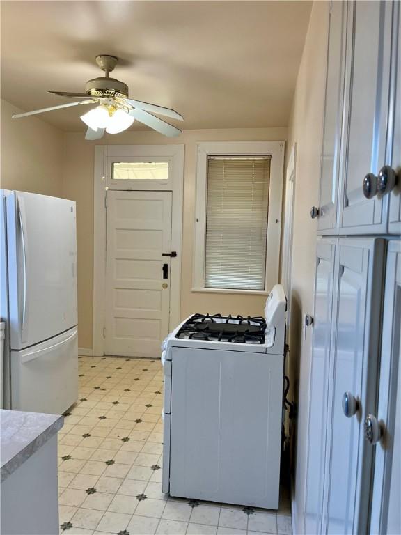 520 Berwin Ave, Brookline, PA 15226 - kitchen with white appliances, a ceiling fan, light countertops, and light flooring