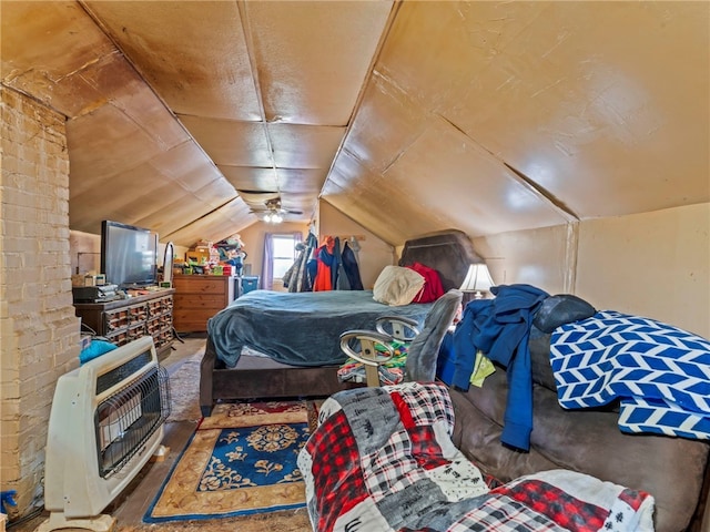 bedroom featuring lofted ceiling and heating unit