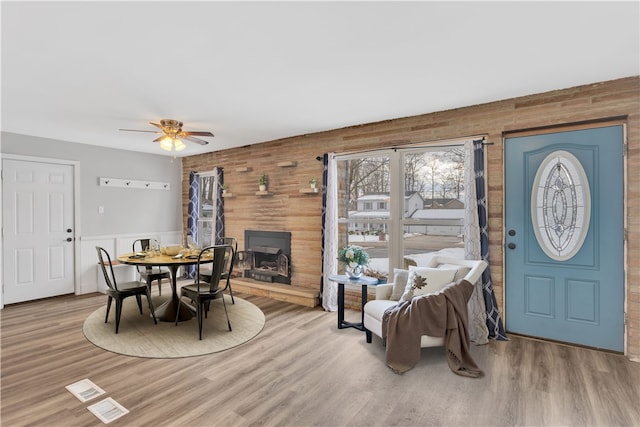 dining space with ceiling fan and light hardwood / wood-style floors