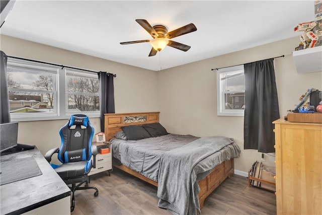 bedroom featuring ceiling fan and hardwood / wood-style floors