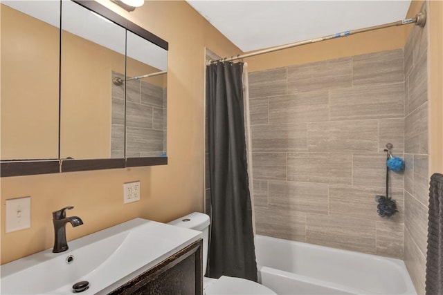 full bathroom featuring vanity, shower / bath combination with curtain, and toilet