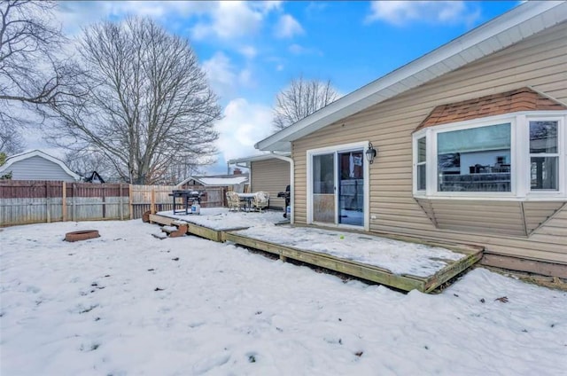 view of snow covered deck