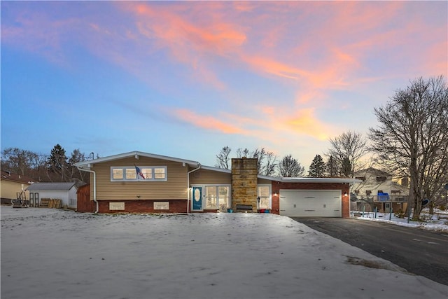 split level home featuring a garage