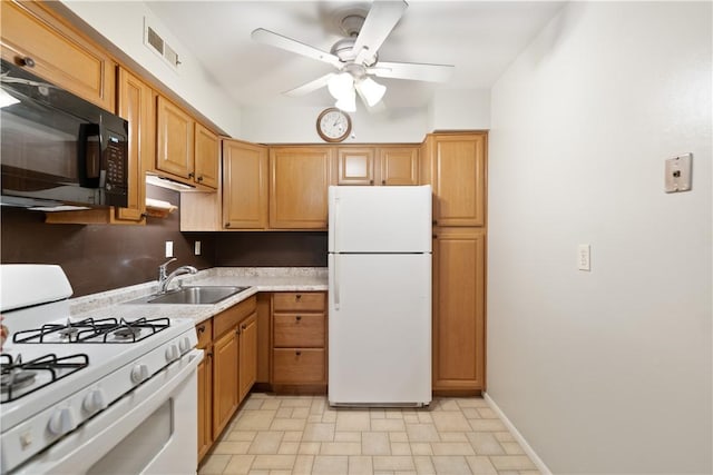 kitchen with ceiling fan, white appliances, and sink