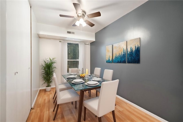 dining space featuring light hardwood / wood-style flooring and ceiling fan